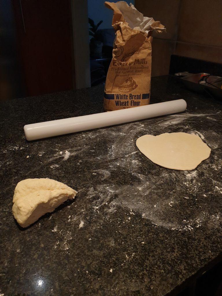 Naan dough rolled into shape