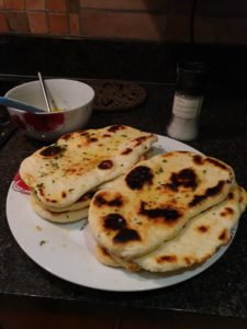 Freshly baked Naan bread brushed with melted butter