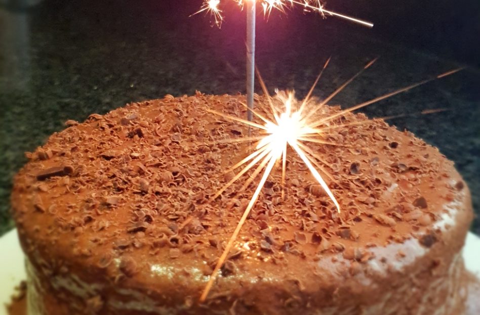 A delicious chocolate cake decorated with a sparkle.